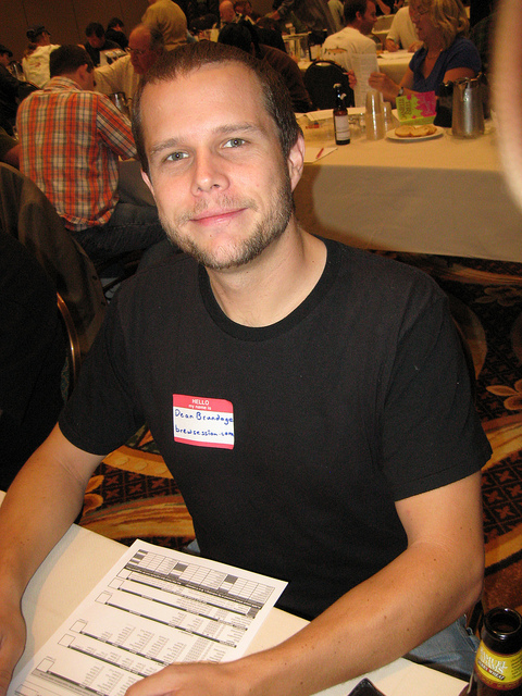 Smiling Dean at a table in front of a beer judging scoring sheet